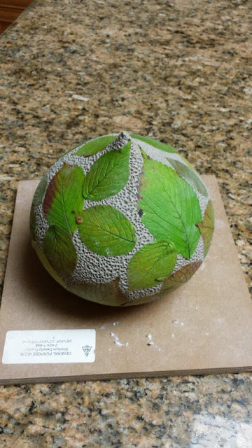 Ceramic pottery vessel with leaf imprints, in progress.
