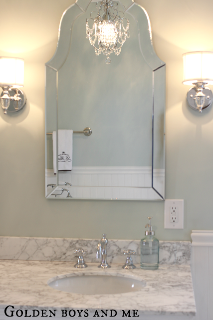Master Bath with carrera, waterton sconce, chandelier, lowes arch frameless mirror - www.goldenboysandme.com