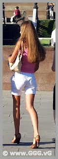 Girl in white shorts on the street