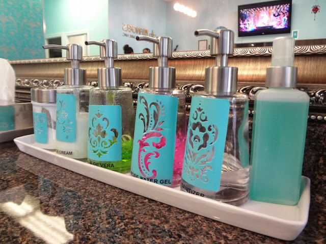 Turquoise bottles of lotions at a beauty salon
