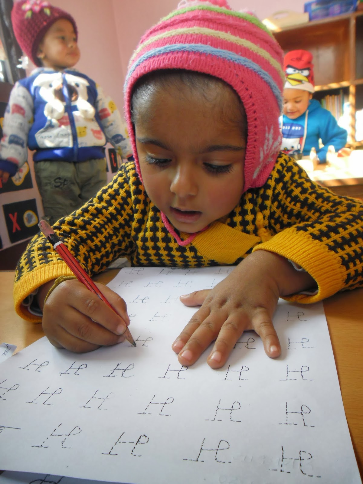 Happy Crayons School Teaching Nepali Alphabets to beginners Nursery