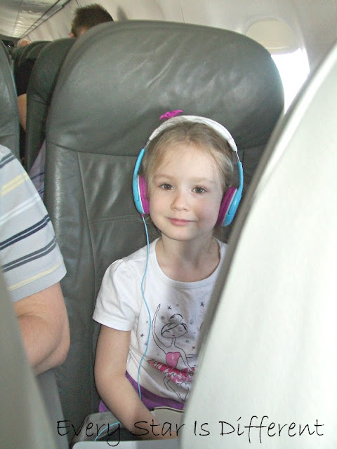 Enjoying first flight on an airplane