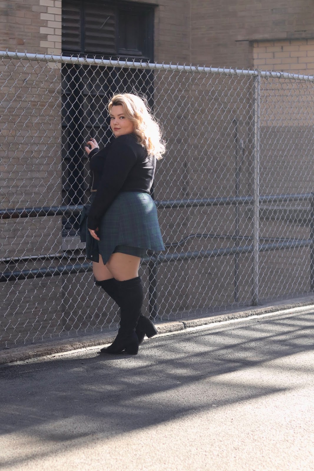 Chicago Plus Size Petite Fashion Blogger and model Natalie Craig reviews Soncy's Not Your Average Plaid Skirt and The Zip It Up Lightweight Sweater.
