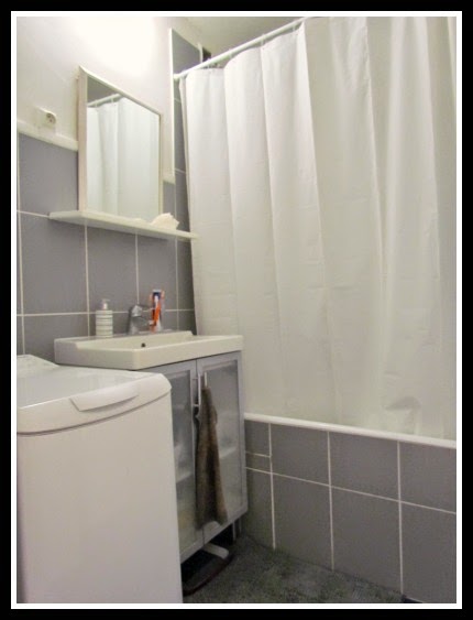 In a tiny bathroom, close the shower curtain and use a minimal color palette