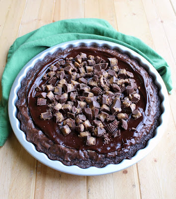 full peanut butter cheesecake brownies in tart pan