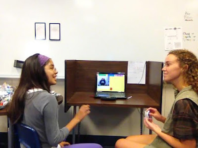 photo of two young women communicating