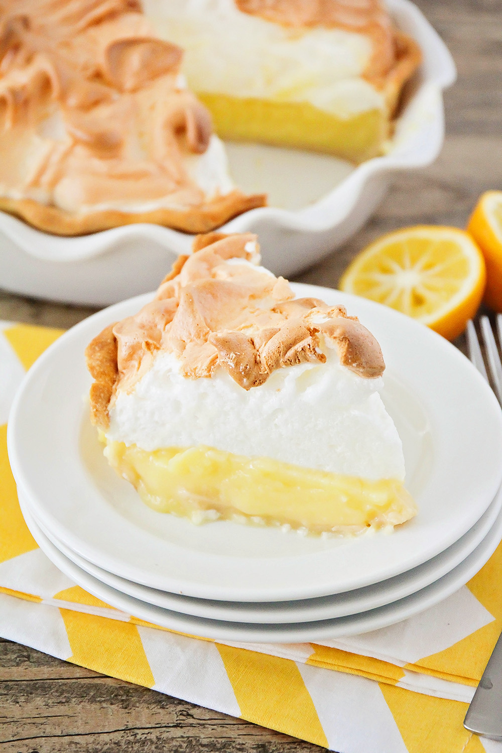 This lemon meringue pie is so heavenly and easy to make too! Deliciously tart and flavorful lemon custard topped with clouds of sweet fluffy meringue, for a show-stopping dessert!