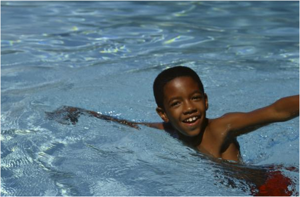 African American child swimming