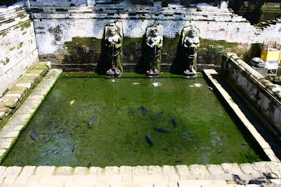 Holy water pond with three statues at Goa Gajah Gianyar Bali