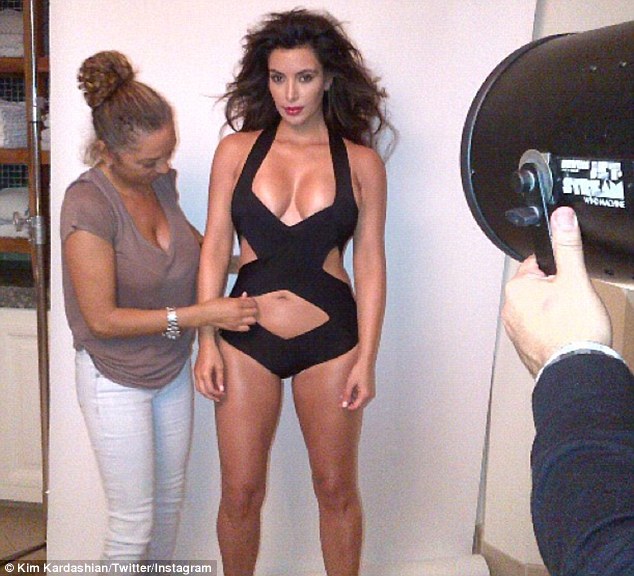 Kim Kardashian Shows Off Her Sculpted Body In Cutout Swimsui