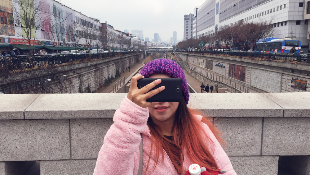 Her taking me. Yulgok-ro passing over Cheonggyecheon, Jongno-gu, Seoul, South Korea. 31 December 2015.