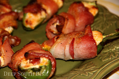 A delicious party appetizer, these bacon wrapped, smoked sausage and cheese stuffed jalapenos are a true crowd pleaser.