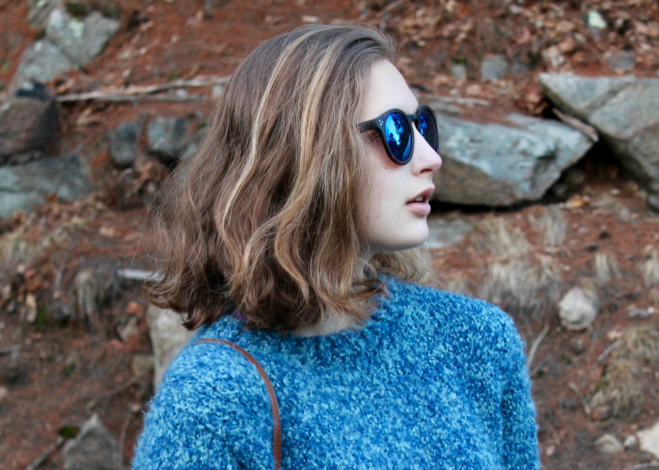 Blue handmade knit sweater, LA Hearts blue reflective sunglasses, bootcut dark washed jeans and leather slip on sneakers
