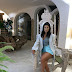 Kourtney Kardashian looks regal as she sits on a white throne in a throwback photo from her summer trip to Italy
