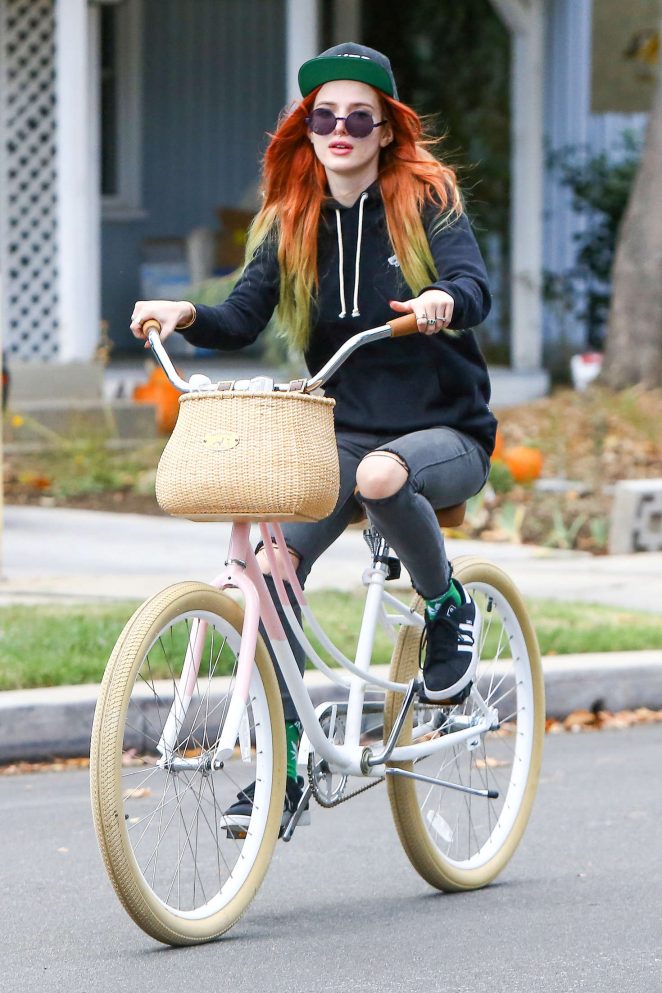 Celebrity Girls Pics: Bella Thorne In Ripped Jeans Riding A Bike In