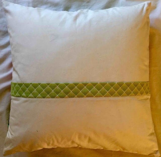 Hidden zipper behind the green placket on this pillow back.