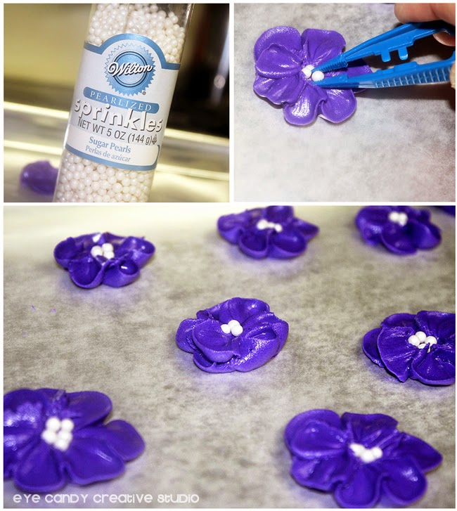 flowers centers, piped purple flowers, white Wilton sprinkles, tweezers