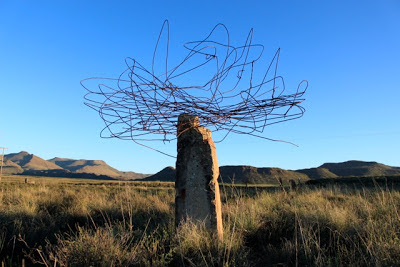 Land Art - wire on a rock outcropping in a landscape, by Strijdom van der Merwe