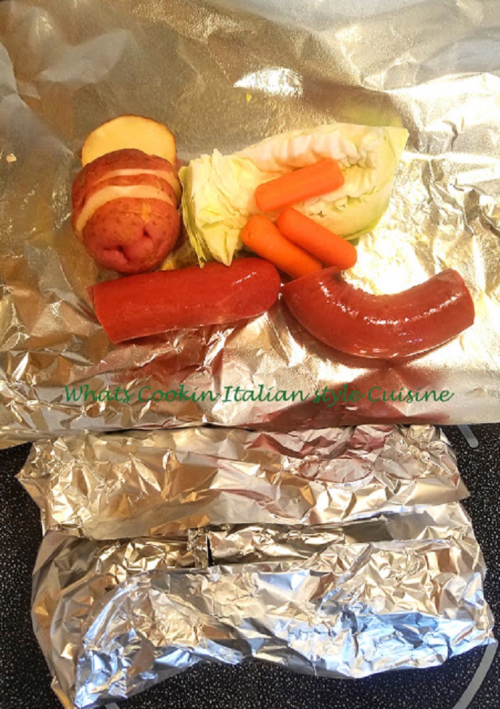 Making camping foil packets filled with kielbasa or any kind of meat with vegetables wrapped in foil grilled or baked for a fun package and surprise all in one dinner foil packets for dinner