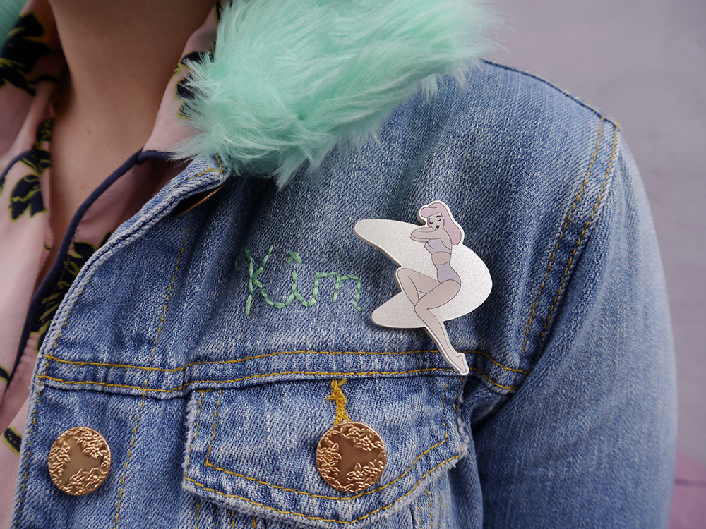 Retro pin up girl atomic pin badge on a personalised demin jacket with faux fur collar