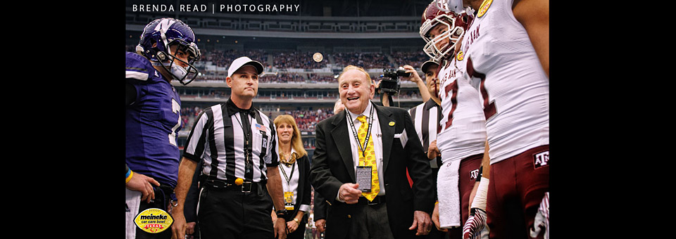 Sam Meineke tossing the coin prior to the Meineke Bowl Game in Reliant Stadium