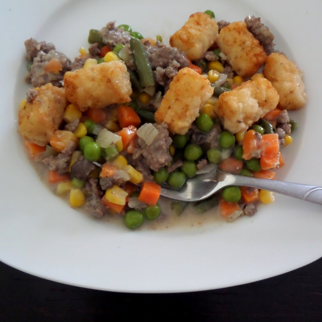 Tater Tot Hotdish:  Ground beef and veggies in a creamy sauce topped with tater tots.