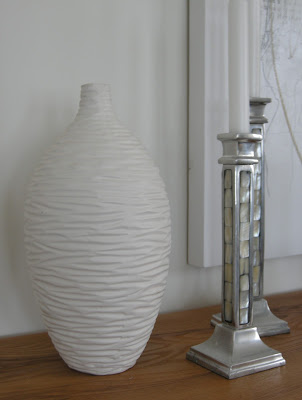 white textured vase, silver candlesticks, mother of pearl