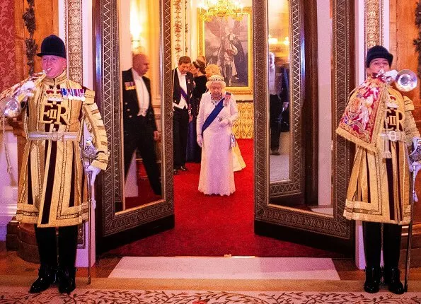 Kate Middleton wore a velvet Alexander McQueen gown, the Lover's Knot tiara, the Nizam of Hyderabad necklace