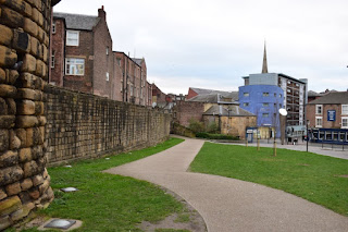 A path seperates the Town Walls from Bath Lane