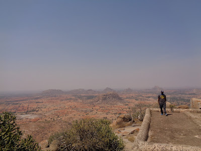 Madhu standing on top of one of the barracks at the top of medigeshi fort