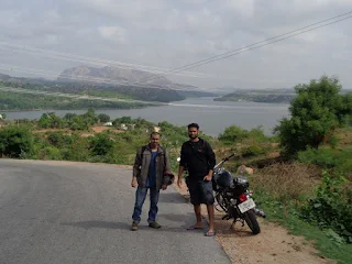 Savandurga Top View: Panoramic view of the vast landscape and clouds from the summit of the hill.