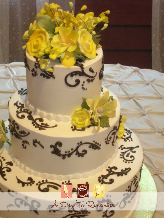 The wedding cake was designed in black scrollwork and accented with a 