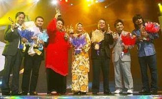 Winners (from left): Hazami, Azlan Abu Hassan, Adibah Noor, Habsah Hassan, Ayob Ibrahim, Zahid and M. Nasir with their trophies at Stadium Putra Bukit Jalil. 