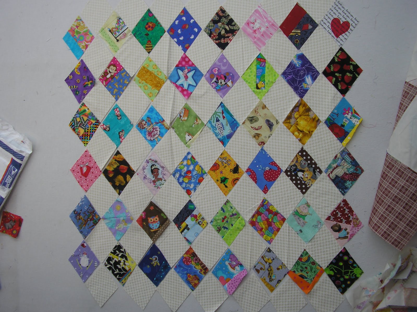 Thread and Bolts Quilting Baby Boondoggle ruler and a scrap box of fabrics