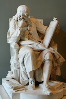 Statue of Blaise Pascal thinking and reading