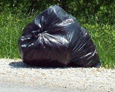 image: Garbage+bag+by+the+side+of+the+road