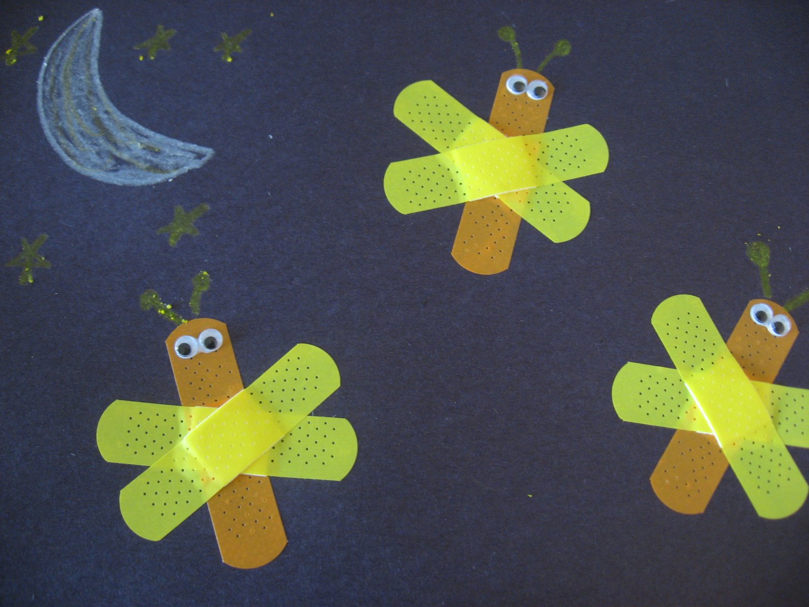 Lightning bugs with band aids art. 