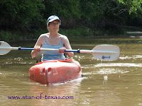 lady in a kayak on the Pecan bayou