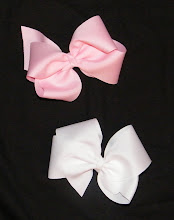 These bows are made out of 2 1/4 inch ribbon. I have brown, baby pink, white, and black.