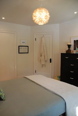 master bedroom before and after, bedroom wall moulding, bright master bedroom renovation, bedroom with accent wall, DIY panelled wall, board and batten wall
