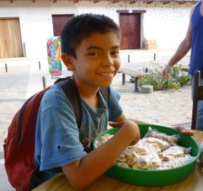 child selling cashews