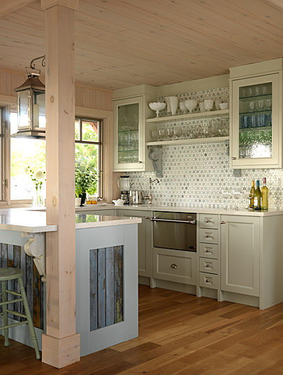Blue and green tones in a rustic farmhouse style kitchen with knotty pine ceiling