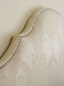 Damask upholstered headboard with nailhead trim - Sarah Richardson