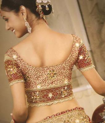 Embroidery saree blouse with scalloped border.