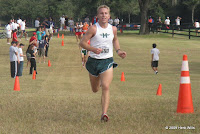 Brian Atkinson of Melbourne passes the 3,200m flag with an authoritative lead in the boys' 4A race.