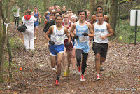 A tight pack leads the FACA Senior All-Star Boys' Cross-Country race at two kilometers.