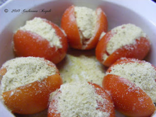 Sprinkle Parmesan and Romano Cheese on top of Italian Stuffed Tomatoes