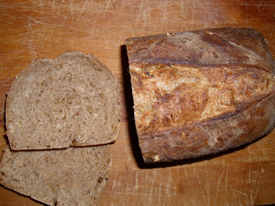 Baked bread with a slice cut off