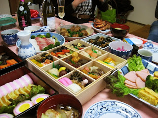 The gorgeous spread of traditional New Year's foods at Morinaga-san's house -- note the hard boiled eggs encased in fish paste on the left in the foreground.