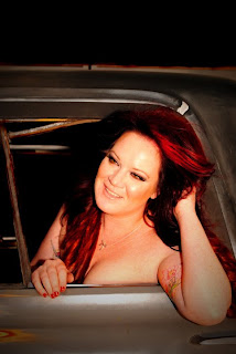 sexy picture of girl with red hair in truck